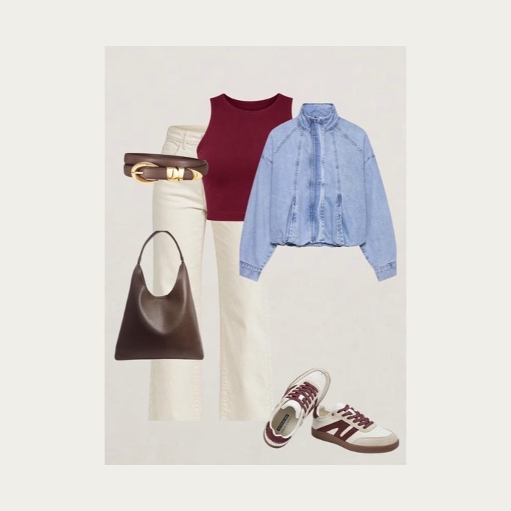 Fall capsule wardrobe with a burgundy tank, cream jeans, denim jacket, brown bag and belt, and cream sneakers