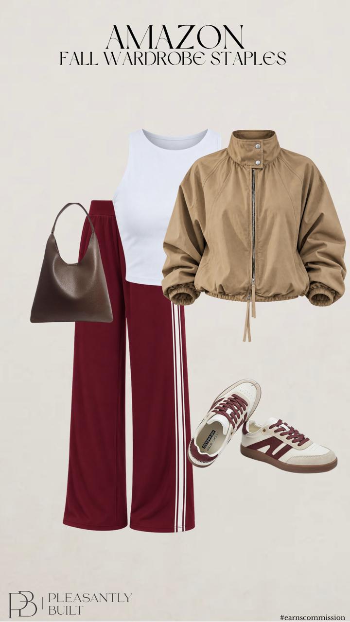 Sporty fall outfit with a white racerback tank, burgundy wide leg track pants, tan cropped bomber jacket, dark brown hobo bag, and cream sneakers with burgundy accents